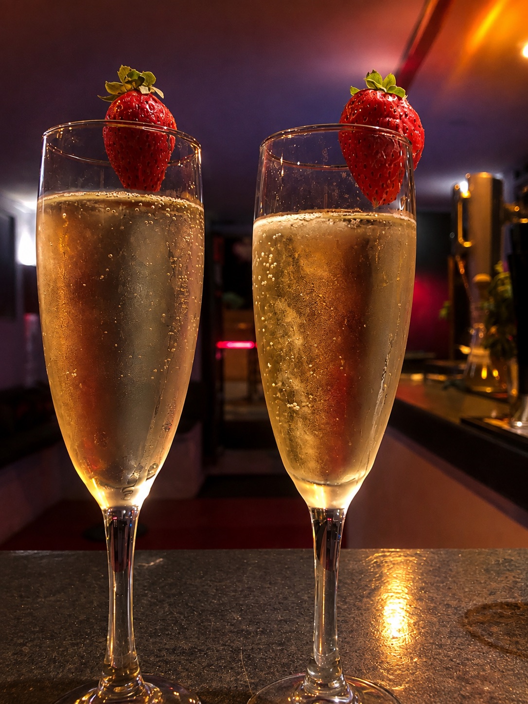 Two glasses of sparkling wine with strawberries