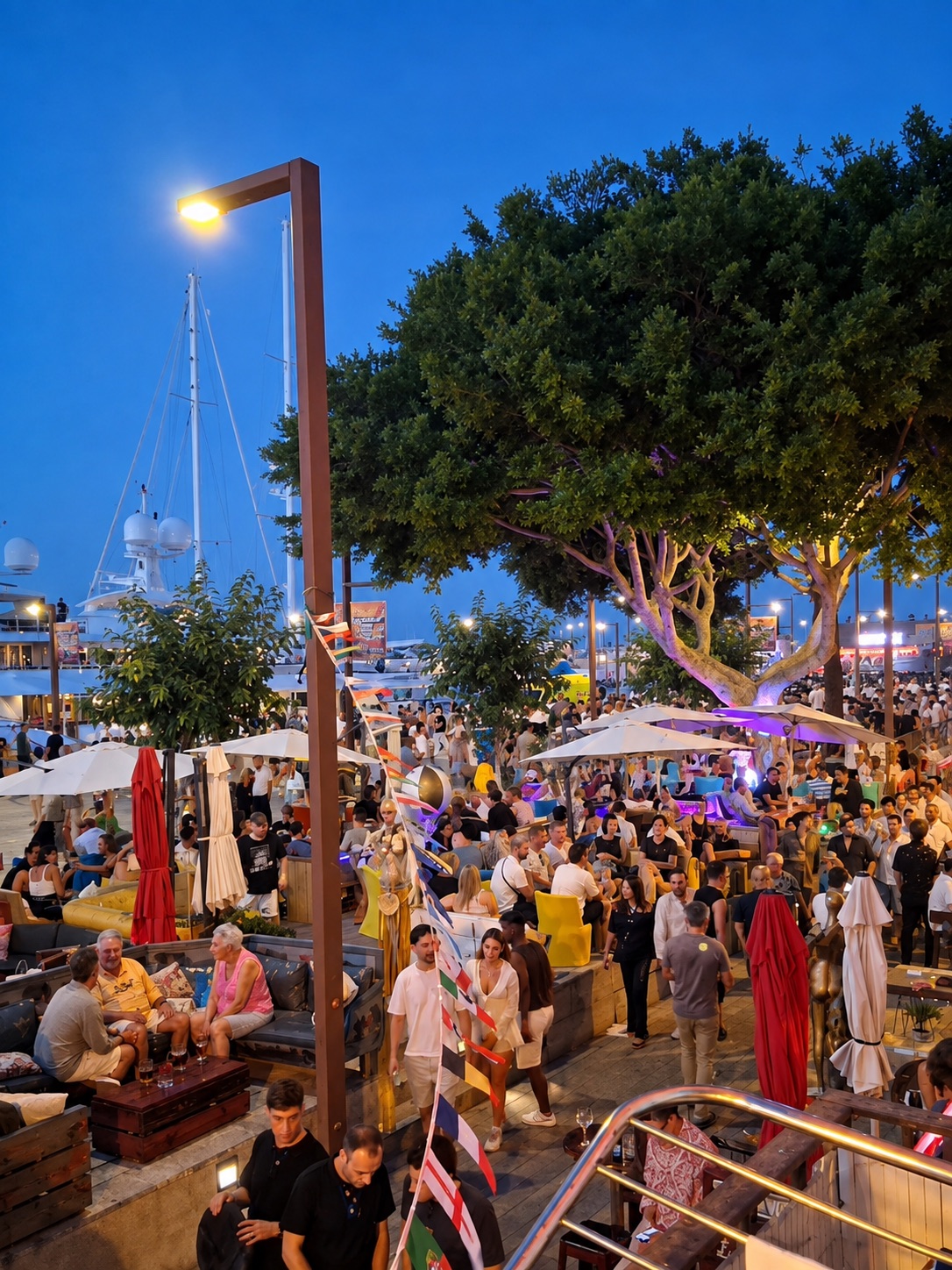Lively Ibiza Port terrace at dusk